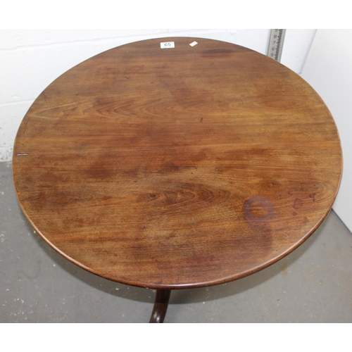 65 - An 18th century circular oak tilt top table, 30