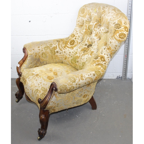 71 - Victorian button backed armchair standing on impressive carved wooden legs