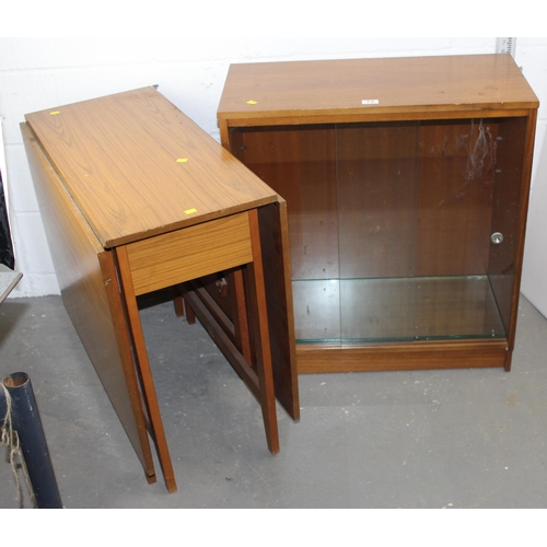 72 - A vintage dropleaf table and a retro glazed bookcase