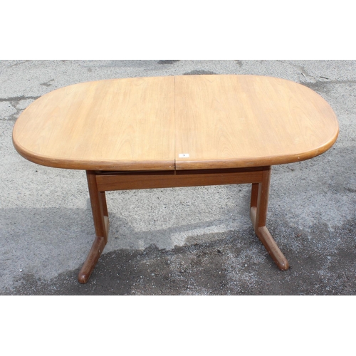 9 - A retro Danish extending dining table and base with extra leaf