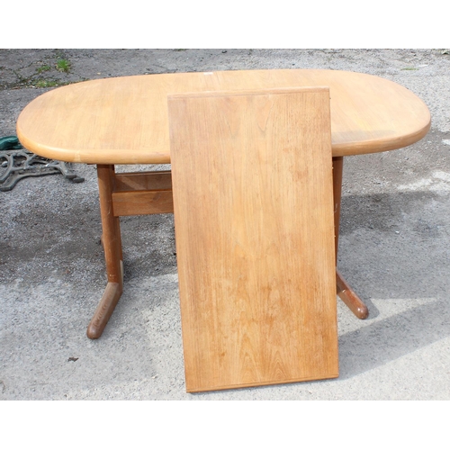 9 - A retro Danish extending dining table and base with extra leaf