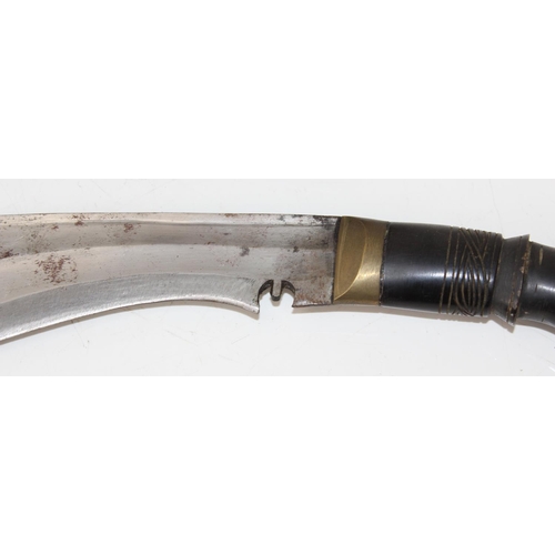 1056 - A British Army kukri in scabbard - c. Malaya Conflict period