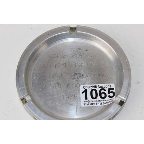 1065 - A aluminium ashtray inscribed 