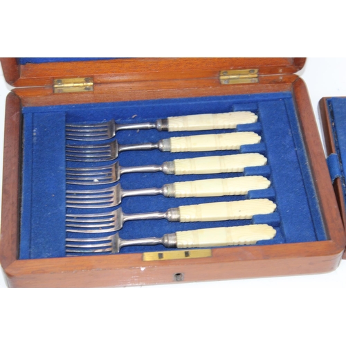 1135 - 2 boxed sets/ part sets of fish knives and forks in mahogany boxes, some silver handled