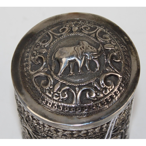 1138 - An Indian white metal lidded pot with embossed decoration