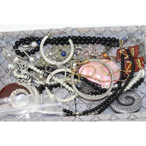 1213 - Aluminium vanity case full of vintage and modern costume jewellery to include necklaces, rings, eari... 