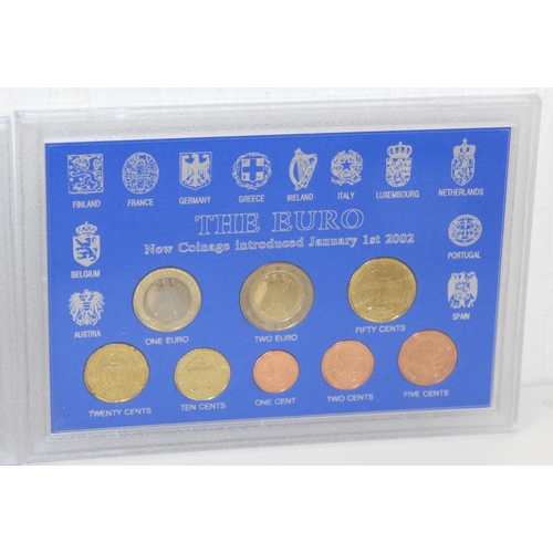 1349o - 3 boxed Euro coin sets - Germany, Austria & Italy