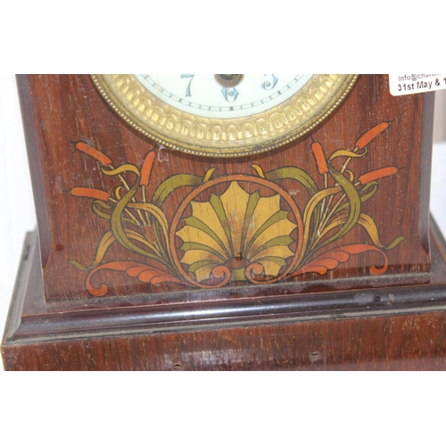 1377 - An Art Nouveau period wooden cased mantle clock decorated with Bulrushes