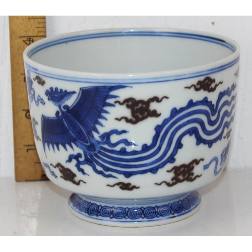 1640 - A 20th century Chinese blue & white with green highlights footed bowl decorated with Phoenix - bears... 