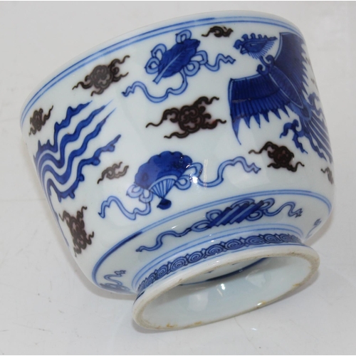 1640 - A 20th century Chinese blue & white with green highlights footed bowl decorated with Phoenix - bears... 