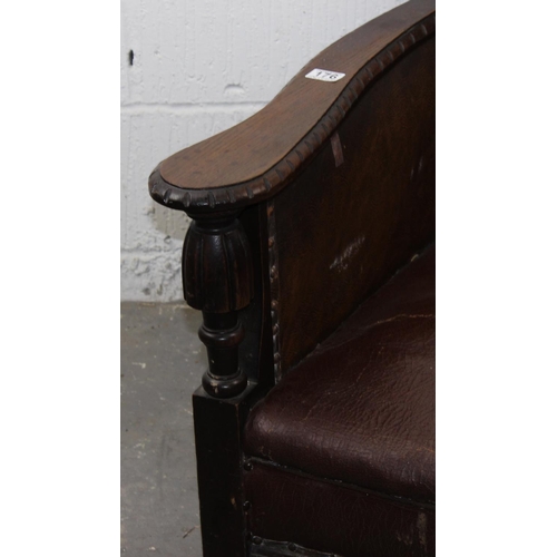 176 - An Art Deco period leather club chair with exposed oak frame