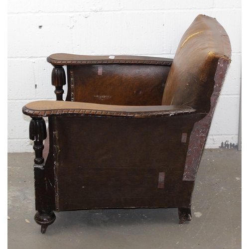 176 - An Art Deco period leather club chair with exposed oak frame