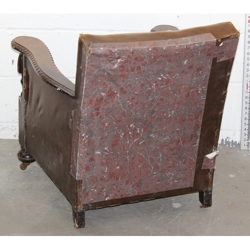 176 - An Art Deco period leather club chair with exposed oak frame