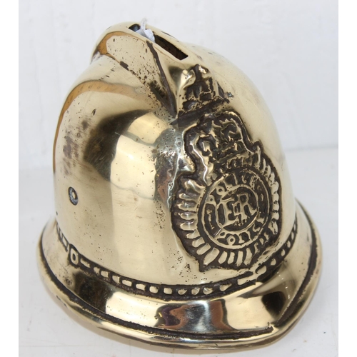 1807 - A 20th century brass police helmet shaped money box