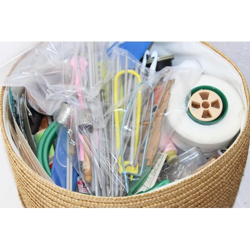 216 - Wicker basket full of mainly vintage haberdashery items including cottons, sewing needles, crochet n... 