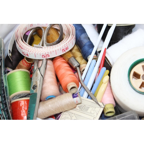 216 - Wicker basket full of mainly vintage haberdashery items including cottons, sewing needles, crochet n... 