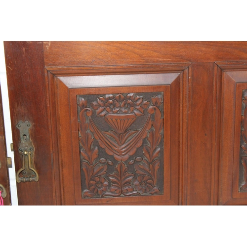 297 - A pair of antique carved wooden cupboard doors