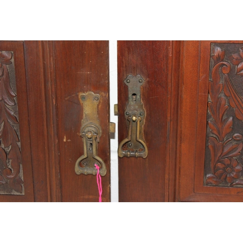 297 - A pair of antique carved wooden cupboard doors