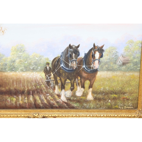 393 - Reg Brown, a pair of 20th Century oil on canvas paintings depicting Shire horses at work - both in a... 