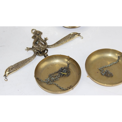 641 - In the manner of Marco Braga - a set of brass balance scales and some weights decorated with fish an... 