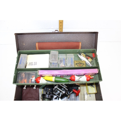 683 - A vintage fishing box and contents to inc various reels