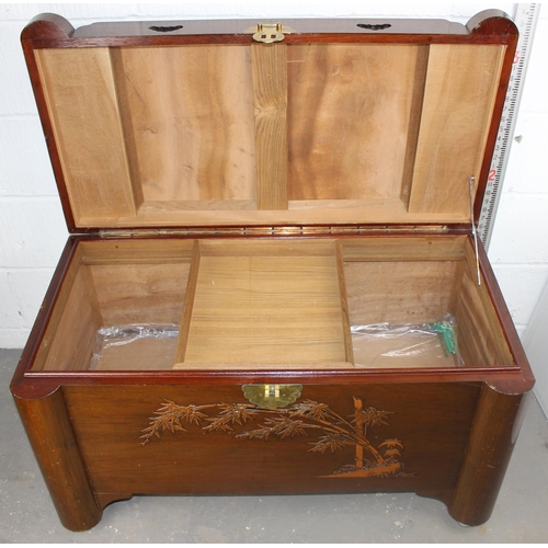 115 - A 20th century Camphorwood chest with bamboo carved details