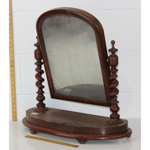 302 - An antique mahogany framed dressing table mirror with Barleytwist supports