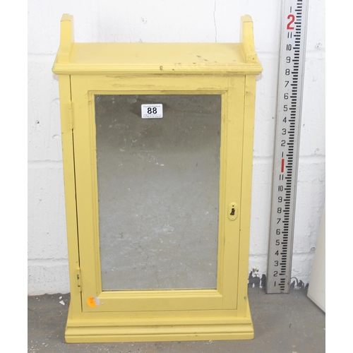 87 - A yellow painted pine mirrored cabinet