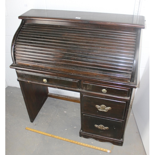 90 - A vintage roll top desk of unusually small proportions