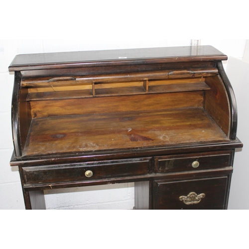 90 - A vintage roll top desk of unusually small proportions