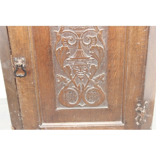 96 - Georgian carved Oak hanging corner cabinet