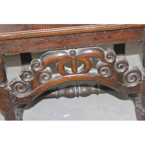 97 - Antique Oak high-backed carved chair believed to be 17th Century