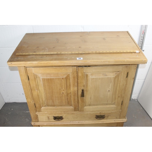 98 - Victorian pine 2-door cupboard on stand with drawer and iron fittings, key present