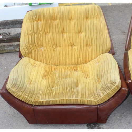 54 - An unusual retro 1970's sofa with mustard coloured button back fabric and brown vinyl base - no make... 