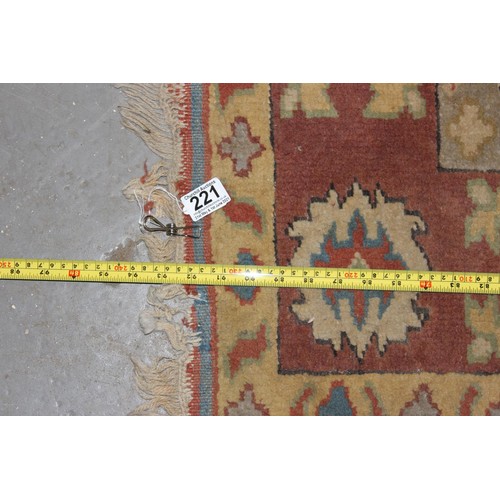 221 - A colourful vintage rug with large central medallion