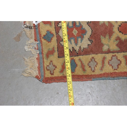 221 - A colourful vintage rug with large central medallion