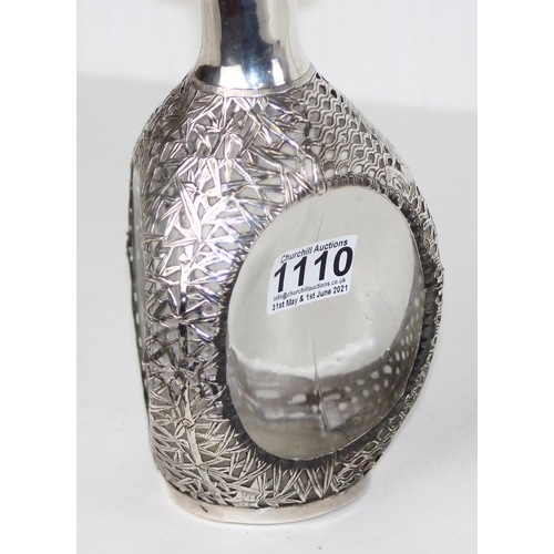 1110 - A vintage silver mounted Dimple Haig whisky bottle with pierced silver overlay decorated in the Chin... 