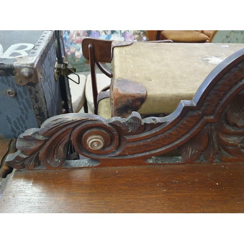 22 - A Victorian Gothic Revival period hall table with carved details in high relief