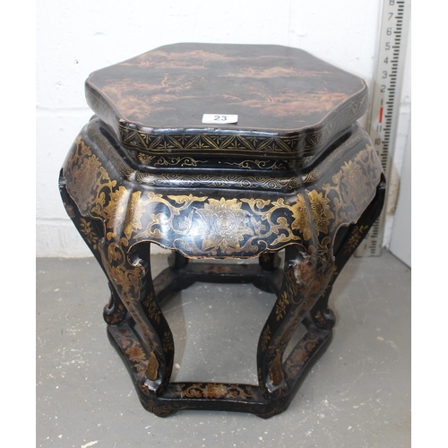 23 - An early 20th century Oriental black lacquer jardiniere stand with painted decoration