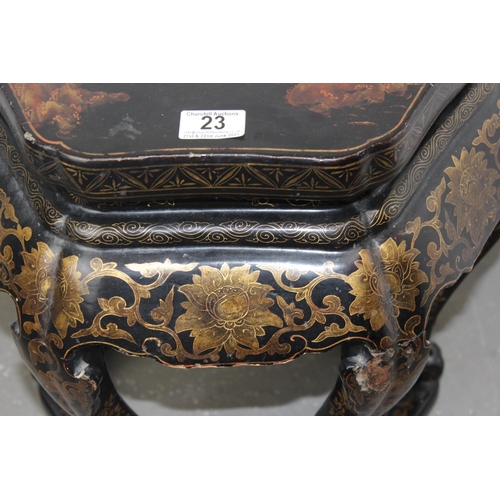 23 - An early 20th century Oriental black lacquer jardiniere stand with painted decoration