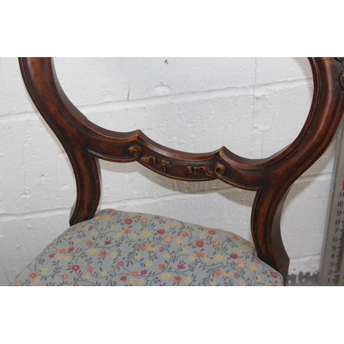 26 - A pair of Victorian Balloon backed dining chairs with carved details