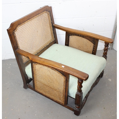 29 - An Art Deco period Jacobean style oak framed sofa and 2 armchairs with Bergere panels