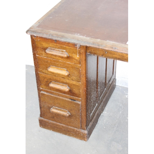 5 - An Art Deco period oak pedestal desk