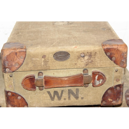 190 - A set of 3 matched travelling trunks/ suitcases marked 