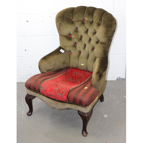 187 - A vintage button back chair with carved wooden legs