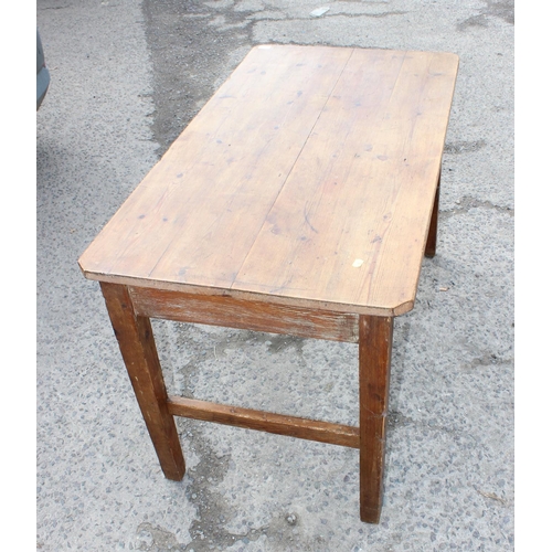 13 - A vintage stripped pine kitchen table