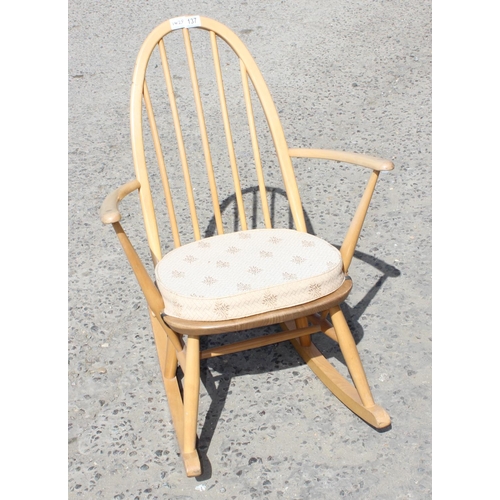 137 - An Ercol blonde hoop back rocking chair