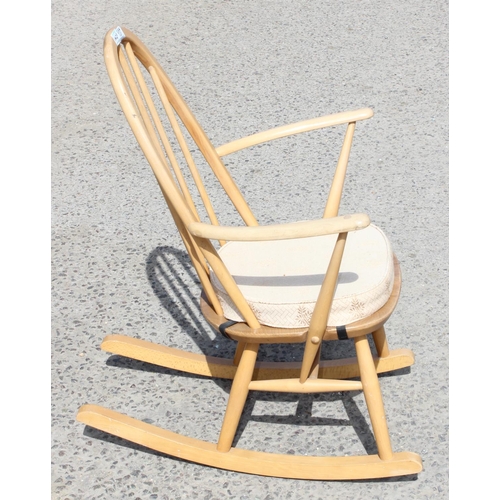 137 - An Ercol blonde hoop back rocking chair