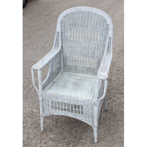 144 - A vintage wicker conservatory armchair