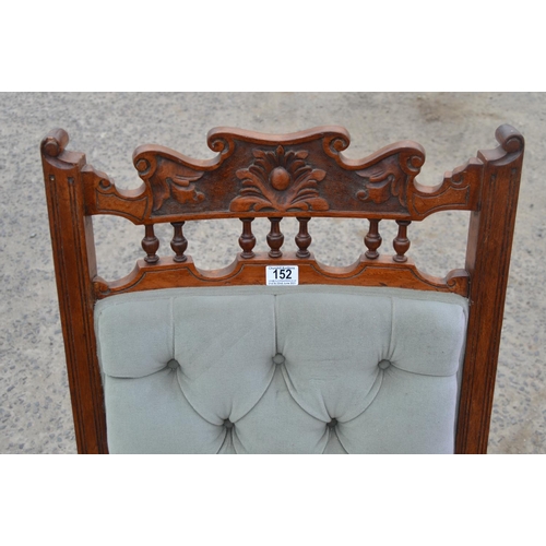 152 - Edwardian button back armchair with carved details